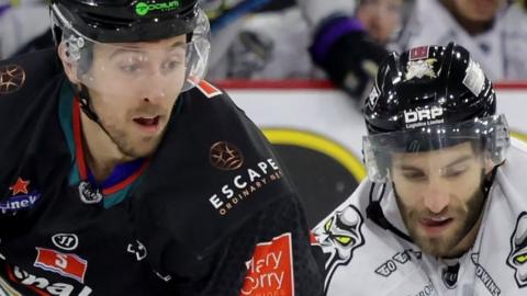 Belfast's Scott Conway with Stephen Johnson of Manchester Storm