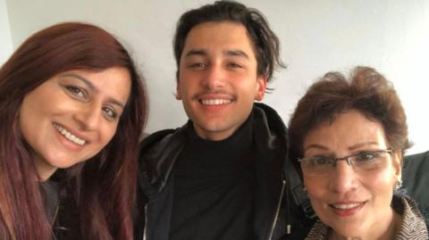 Gini (left), Christopher and Anita nearly 30 years later