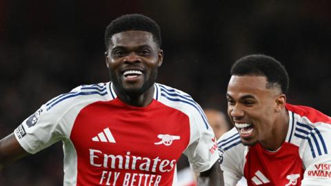 Thomas Partey celebrates a goal with Arsenal team-mate Gabriel