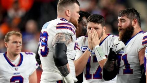 Buffalo Bills players looking worried after Damar Hamlin collapsed