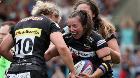 Exeter celebrate scoring a try