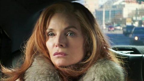 Michelle Pfeiffer sits in the back of a car in a scene from film French Exit