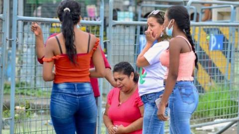 Women cry outside the Guayas 1 prison after clashes between inmates in Guayaquil, Ecuador, on July 23, 2023.