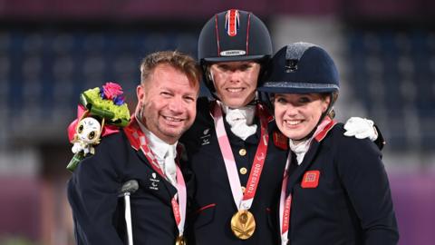 Lee Pearson, Sophie Wells and Natasha Baker celebrate team gold