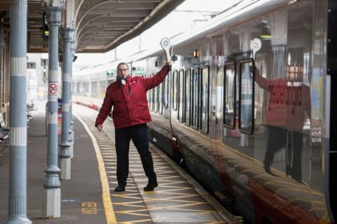 A railway employee to a train driver