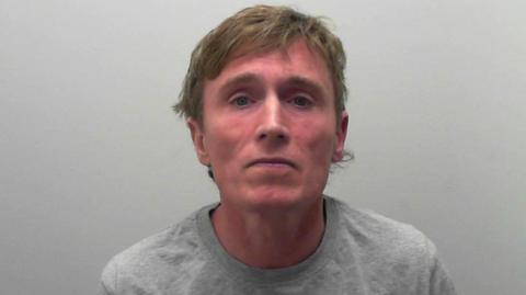 Anthony Winton in a custody image issued by North Yorkshire Police. He is wearing a grey top and has light brown hair.