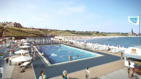 Artist's impression of the redeveloped Tynemouth Outdoor Pool, showing a a large rectangular pool with swimmers and people on sun loungers round the edges, with the sea in the background