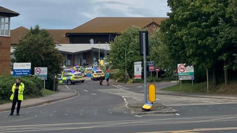 A number of police cars outside QEQM hospital in Margate  