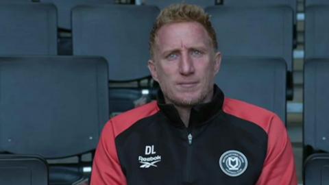 Milton Keynes Dons development coach Dean Lewington.