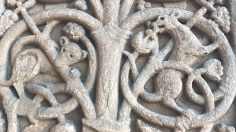 An ornately carved stone panel found at Jedburgh in the Scottish Borders, which most likely formed the gable end of an enclosed shrine or sarcophagus (stone coffin) dating from the early 700s