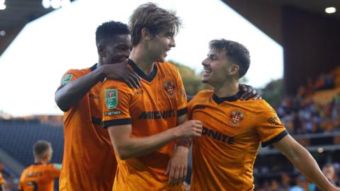Wolves players celebrate scoring