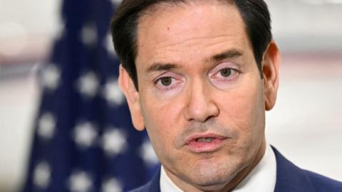 US Secretary of State Marco Rubio speaks to traveling journalists at an airport in Canada on 12 November after the G7 foreign ministers meeting.