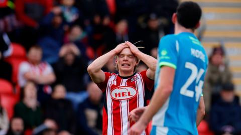 Ilmari Niskanen puts his hands on his head with frustration during draw with Northampton Town
