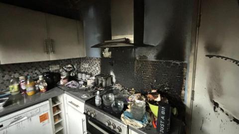 Smoke and fire damage to a kitchen.