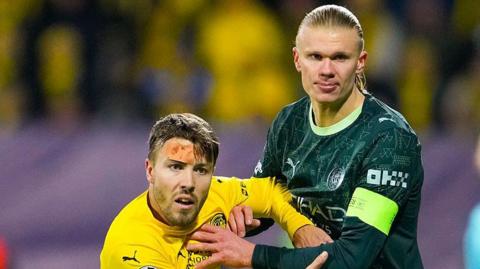 Fredrik Andre Bjorkan vies with Erling Haaland