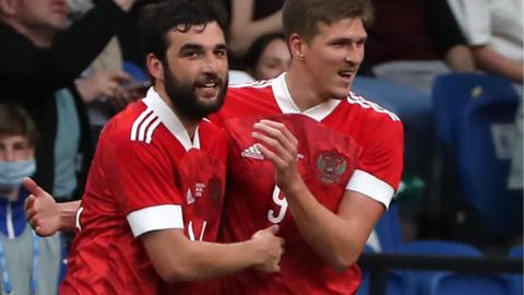 Aleksandr Sobolev (right) and Georgi Dzhikiya celebrate Russia scoring against Bulgaria in a friendly