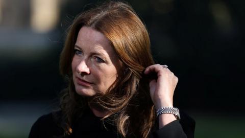 Education Secretary Gillian Keegan touches her hair during an interview