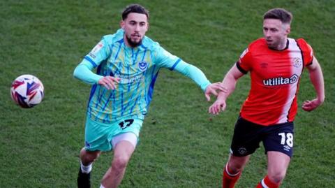 Jordan Clarke (right) in action for Luton Town against Portsmouth at Kenilworth Road