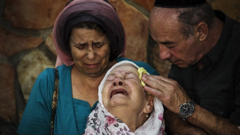 he mother of Albert Alon Govberg mourns at his funeral on October 14, 2015 in Jerusalem, Israel.