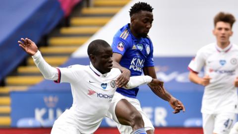 Leicester's Wilfred Ndidi (right) tackles Chelsea's N'Golo Kante