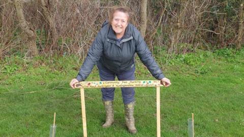 Steph James standing by the community trees in Sapley Park