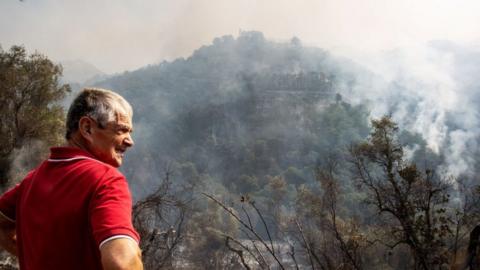 Man in Italy watching fire