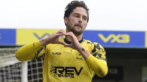 Jordan Young celebrates scoring his fourth goal in five games for Torquay United