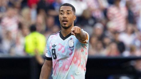 Youri Tielemans points during World Cup game for Belgium