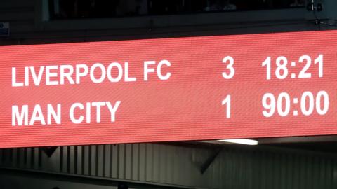 Scoreboard shows Liverpool leading Man City 3-1