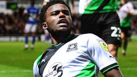 Bali Mumba celebrates scoring a goal against Ipswich Town