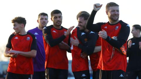 Truro City players celebrate a win