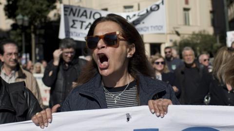 Greek journalist chants anti-austerity slogans during a protest in central Athens