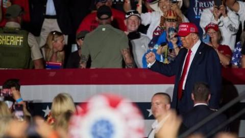 ormer US President and current Republican presidential nominee Donald Trump leaves after speaking during an election rally in Coachella, California, 12 October 2024.