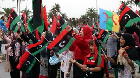 A group of people attend a celebration rally on the fourth anniversary of Gaddafi's death at the es- Suheda square in Tripoli, Libya on 20 October 2015