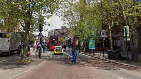 StreetView Image of Lewisham HIgh Street with buses, cars and pedestrians