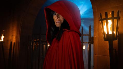 Claudia Winkleman in a red cloak