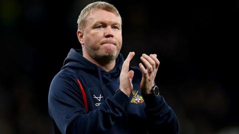Grant McCann applauds