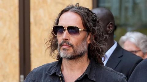 Russell Brand arrives outside court