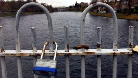 Padlocks on footbridge