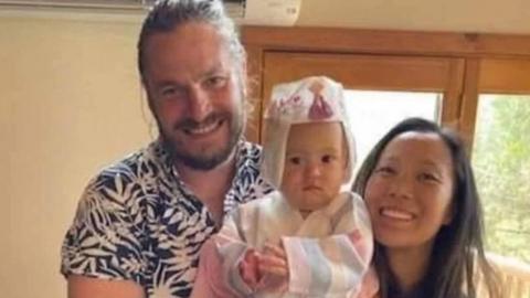 Image shows John Gerrish and his wife, Ellen Chung, and one-year-old daughter Miju