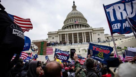 Pro-Trump supporters storm the US Capitol following a rally with President Donald Trump on 6 January , 2021 in Washington DC.