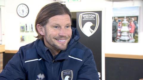 Scott Rogers sitting in the club house