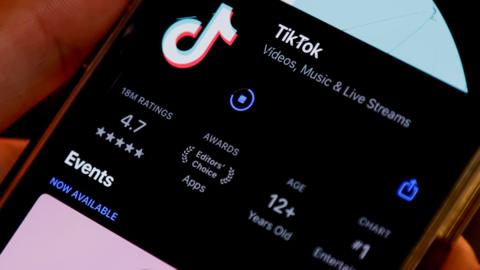 TikTok app downloading onto a smart phone