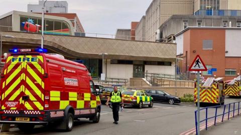Two fire engines and a contact point fire van outside Leicester Royal Infirmary. 