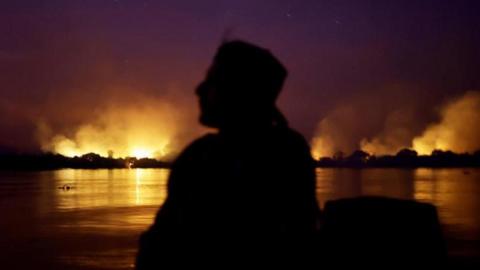 moke from the fire rises into the air as trees burn amongst vegetation in the Pantanal, the world's largest wetland, in Corumba, Mato Grosso do Sul state, Brazil, June 9, 2024.