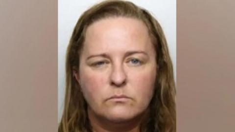 Custody image of Stacey Smith who has dark blond hair.