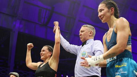 Chantelle Cameron has her hand raised