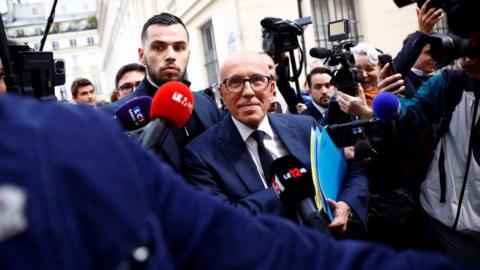 Eric Ciotti, head of the French conservative party Les Republicains (The Republicans - LR), is surrounded by journalists