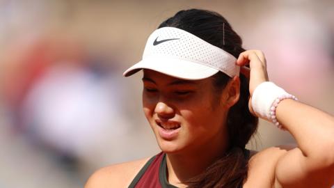 Emma Raducanu reacts during her French Open defeat by Iga Swiatek