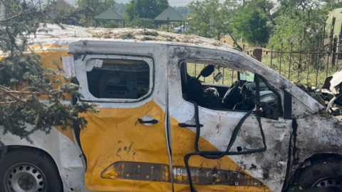 A photo posted by Ukraine's state emergency service DSNS showing a destroyed postal service vehicle in Yarova, Donetsk region